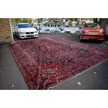 An extremely large Bakhtiari carpet, having three central floral medallions on a floral central