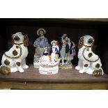 A group of Victorian Staffordshire pottery figures, to include a pair of Spaniels, 23.5cm high. (5)