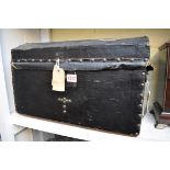 A small Victorian domed top trunk, labelled 'A Jackson... Manufacturer, Davey Place, Norwich',