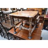 An antique walnut and inlaid occasional table, of shaped outline, 56cm wide.