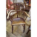 A near pair of Victorian ash and elm Windsor armchairs.