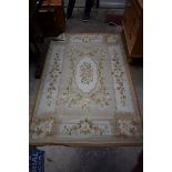 An old rug, having allover floral decoration, 180 x 117cm.