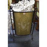 A late Victorian steel and brass fire screen, 47.5cm wide.