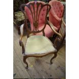 Two mahogany and line inlaid elbow chairs.