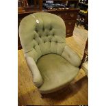 A Victorian walnut and button upholstered occasional armchair.