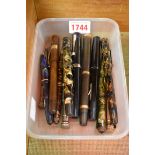 A collection of vintage pens and propelling pencils, to include three with 14ct nibs; and a silver