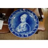 A Dutch Delft blue and white charger, painted with James II as a child, after Anthony Van Dyck, 41.