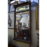 An early 19th century gilt frame pier mirror, with verre eglomise frieze, 81.5 x 46cm.