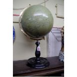 A reproduction antiqued 12in table globe, by Greaves & Thomas, London, on ebonized stand, total