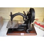 A Willcox & Gibbs sewing machine.