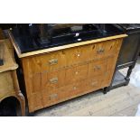 A Beidermeier birch and ebonized commode, 108cm wide.