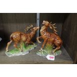 A pair of Continental pottery figures of stags, possibly Sitzendorf, 19cm high.