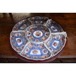 A Chinese Imari seven piece hors d'oeuvres set, in lacquer circular box and cover, 33cm diameter.