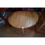 A nest of three vintage blonde Ercol pebble tables.