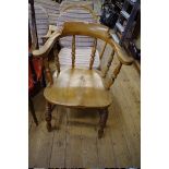 A Victorian ash, elm and beech smokers bow chair.