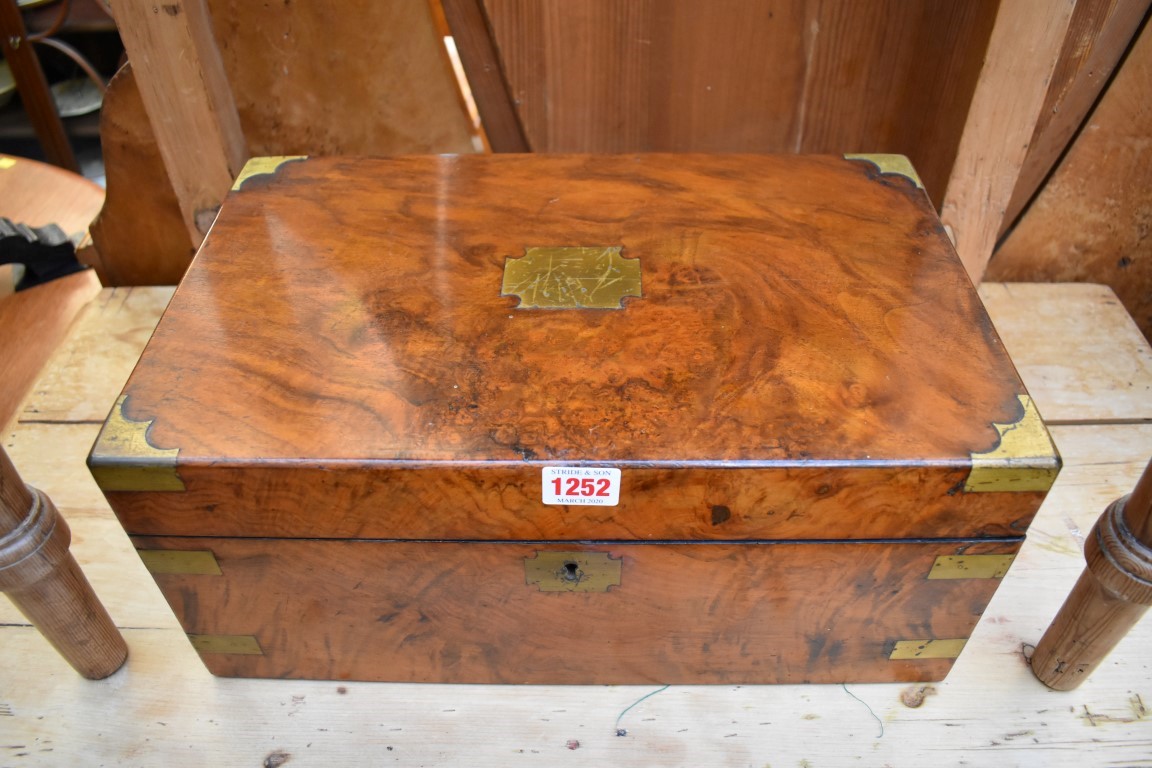 A Victorian walnut and brass bound writing slope, 40.5cm wide.