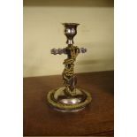 A brass and plated metal fouled anchor candlestick, 18cm high.