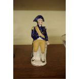 A 19th century Staffordshire porcelaneous figure of Horatio Nelson, 19cm high.