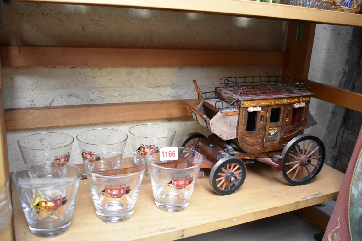 A small group of Wells Fargo commemorative items, to include a stagecoach and six glasses.