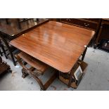 An early 19th century mahogany Pembroke table, with two opposing frieze drawers, on turned legs,