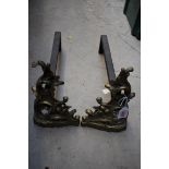 A pair of rococo style cast brass andirons, 21cm high.