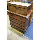 A small reproduction mahogany chest of drawers, 65cm wide.