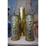 Three brass trench art vases, largest 35cm high.