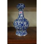 An 18th /19th century tin glazed blue and white garlic head vase, 28.5cm high.