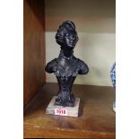 After Jean-Baptiste Defer, a cast metal bust of a lady, in the belle epoque style, on marble base,