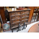 A 17th century style oak chest on stand, 99cm wide.