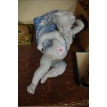 An interesting 19th century Cantagalli blue and white tin glazed cherub wall pocket, 46cm high.