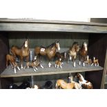 Eleven Beswick brown horses and foals, (repair to two legs of one).