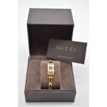 A Gucci '3900L' gold plated quartz ladies wristwatch, 34 x 12mm, with box.