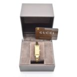 A Gucci '1500L' gold plated quartz ladies wristwatch, boxed with original guarantee card.