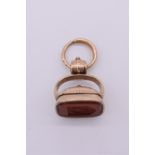 A large and unusual crested carnelian fob seal, unmarked, having hinged compartment, 33mm high,