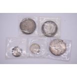 Coins: three silver crowns, Victoria 1889, George V, George VI; and two Victorian silver