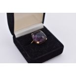 A cushion cut amethyst gold cocktail ring, stamped 9ct, 5.5g total weight.