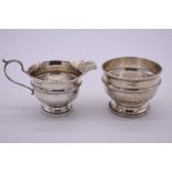 A silver milk jug and sugar bowl, by Walker & Hall, Sheffield 1933, 248g.