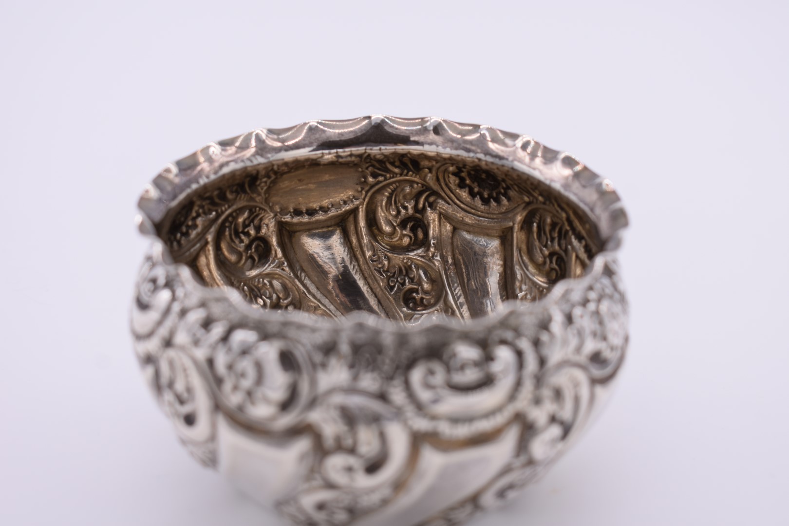 A repousse silver sugar bowl, London marks indistinct, 5.5cm high, 74.5g. - Image 2 of 3