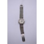 A vintage Roy King silver manual wind wristwatch, 34 x 31mm, hallmarked London 1975, on matching