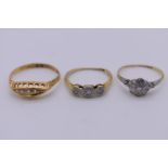 Three various diamond set gold rings, stamped 18ct, 6.5g total weight.