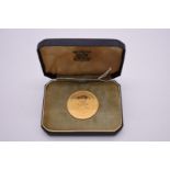 Coins: a cased Oman 1962 gold half Rial, 150 struck, 25.7g.