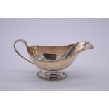 A silver sauce boat, by Carrington & Co, London 1936, 9cm high, 139g.