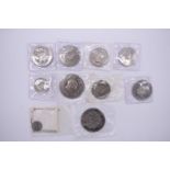 Coins: two Tonga 1967 Coronation two Pa'anga; together with other uncirculated coinage. (10)