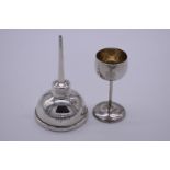 A stirling silver oil dropper, by Tiffany, 9cm high; together with a small German .885 goblet.