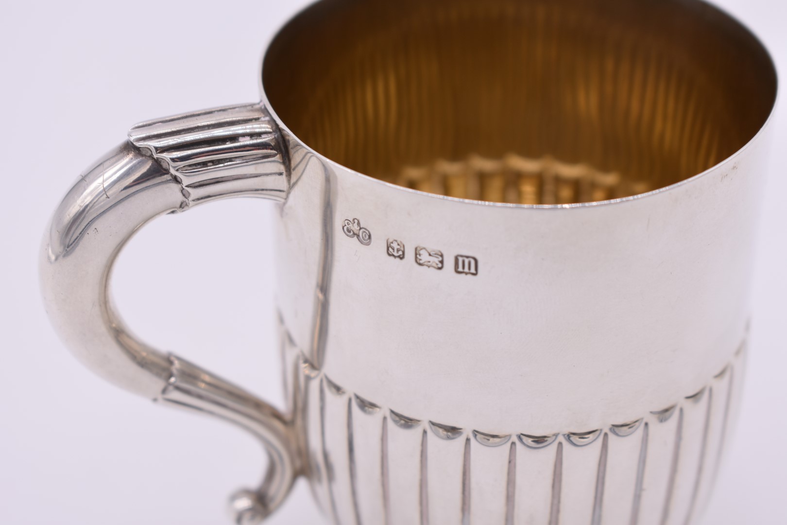 A silver Christening mug, by Elkington & Co Ltd, Birmingham 1911, gilt lined, 9cm high, 199g. - Image 2 of 3