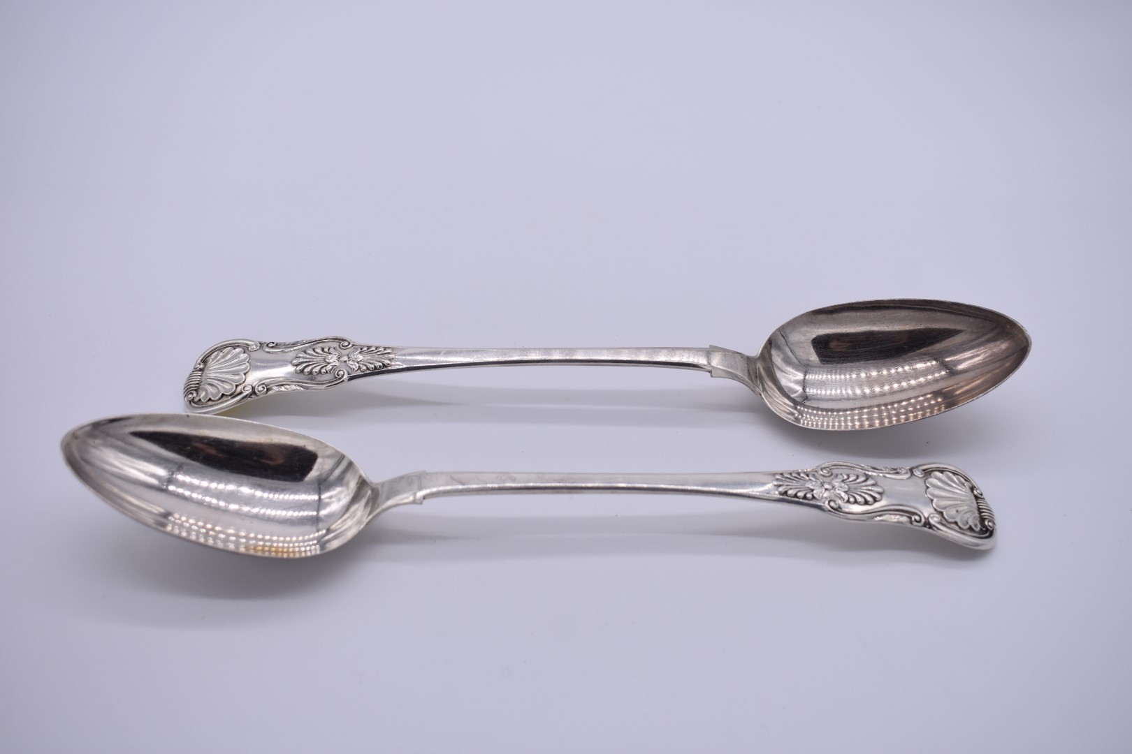 A pair of George IV silver Queens pattern basting spoons, by James Bell, Newcastle 1831, 30cm, 246.