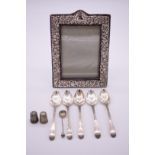A small quantity of silver, to include: an embossed photograph frame, by Keyford Frames Ltd,