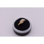 A diamond twist gold ring, hallmarked 750, 3.4g total weight.