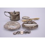 A small group of silver items, to include: an Edwardian silver mustard; a Georgian caddy spoon;